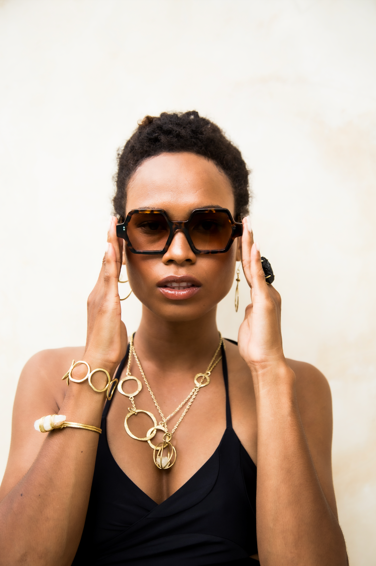 Crafted handmade polarized eyewear worn by a woman in Canggu in Bali supported and adjusted by Maison Mata opticians.