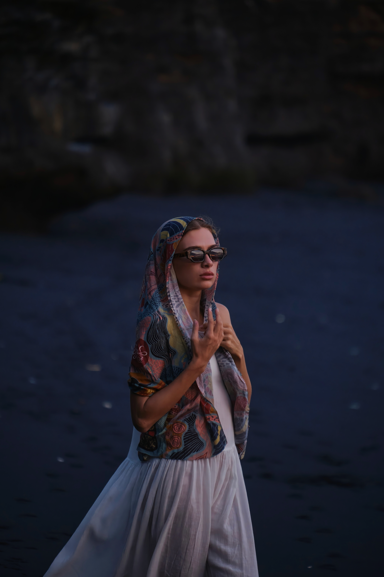 Woman wearing handmade polarized sunglasses on a Bali shoreline in Seminyak adjusted comfortably by expert optometrists.