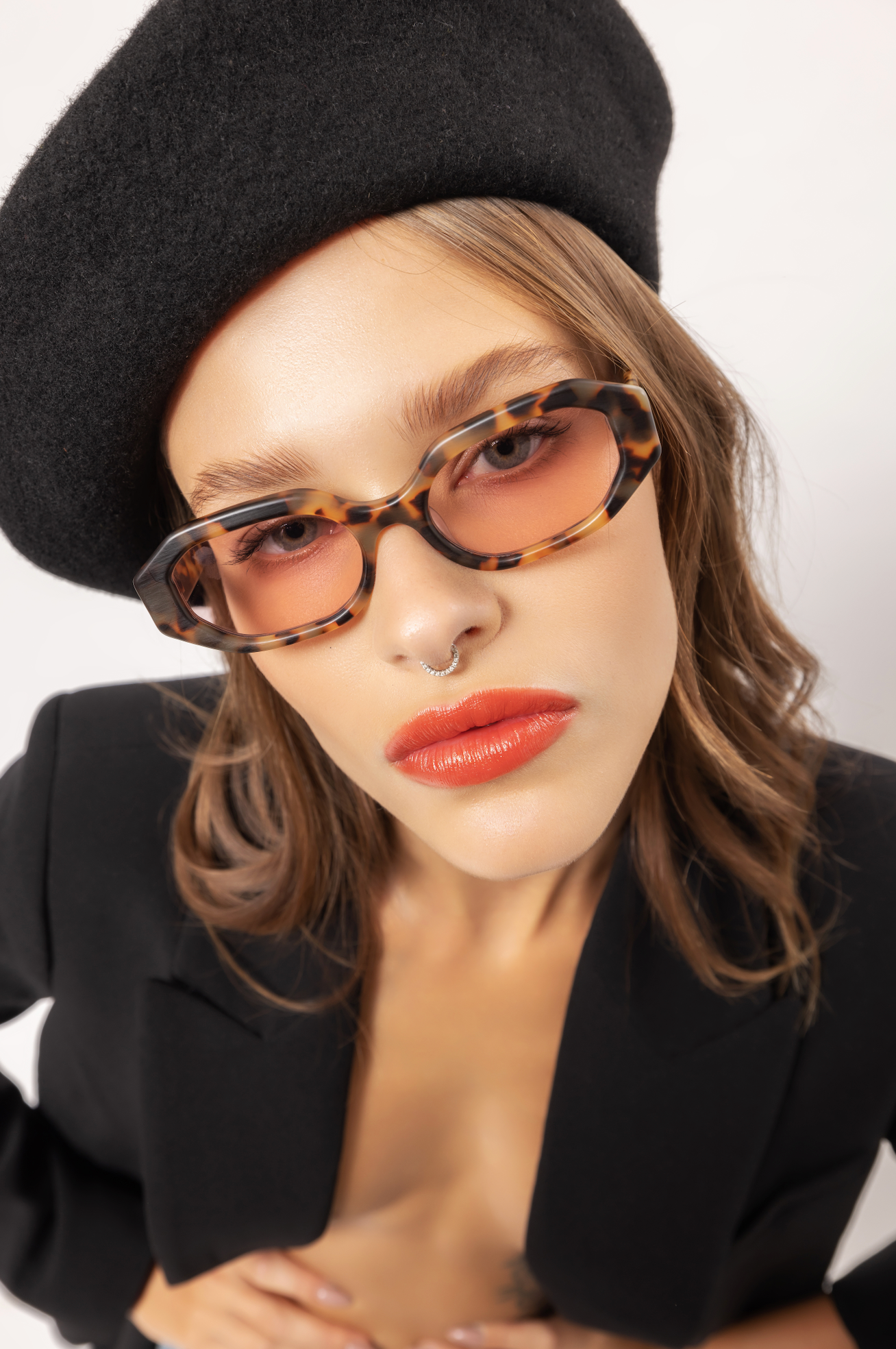 Eco acetate handmade polarized sunglasses worn by a woman in Ubud in Bali adjusted by expert optometrists.