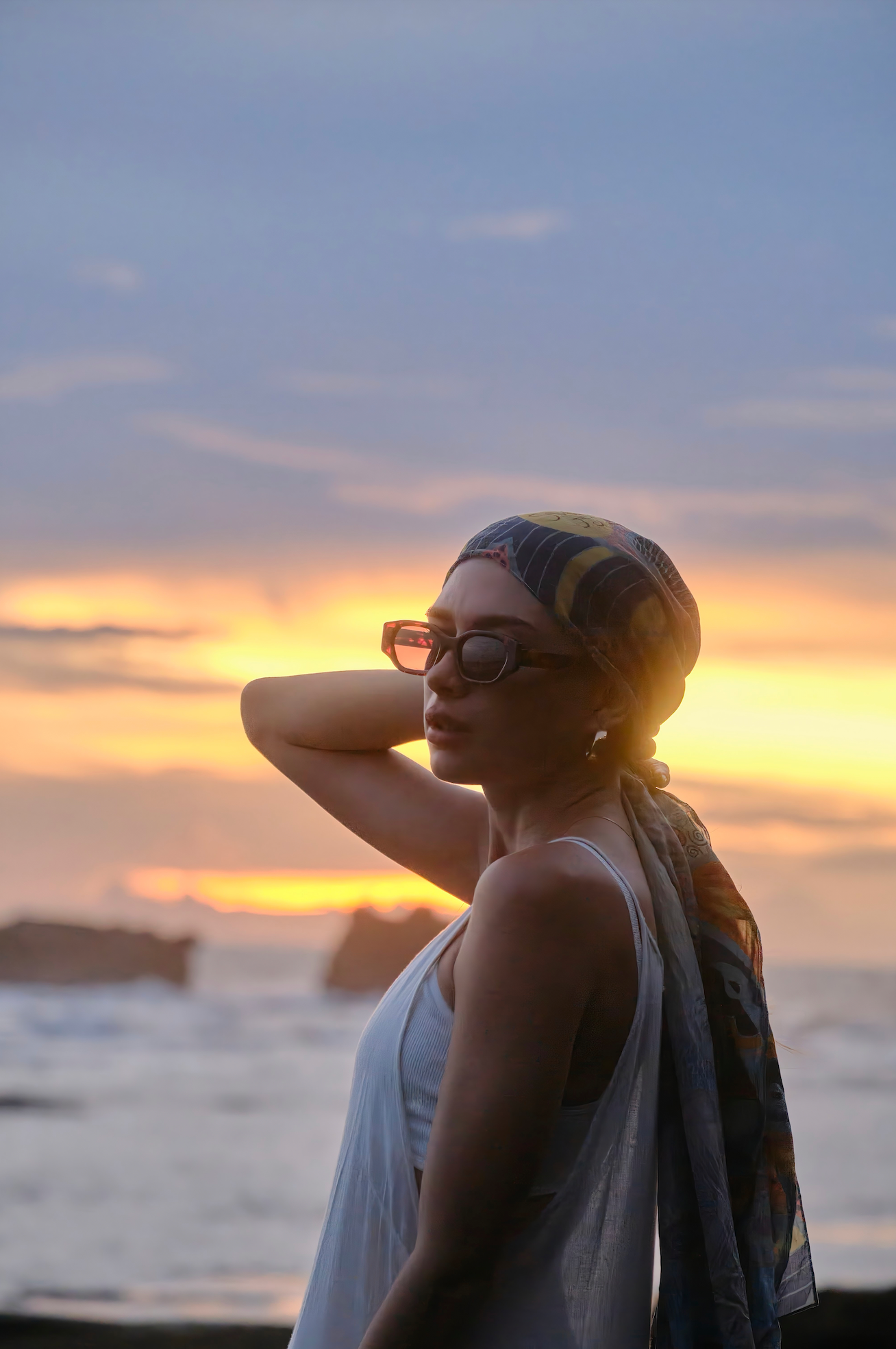 Premium handmade polarized sunglasses worn seaside by a woman in Sanur in Bali fitted by skilled optometrists.